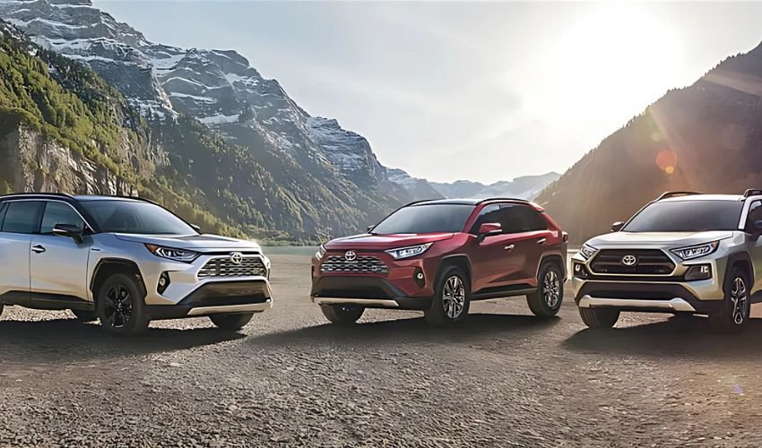 Toyota RAV4 SUVs showcased in a scenic mountain setting