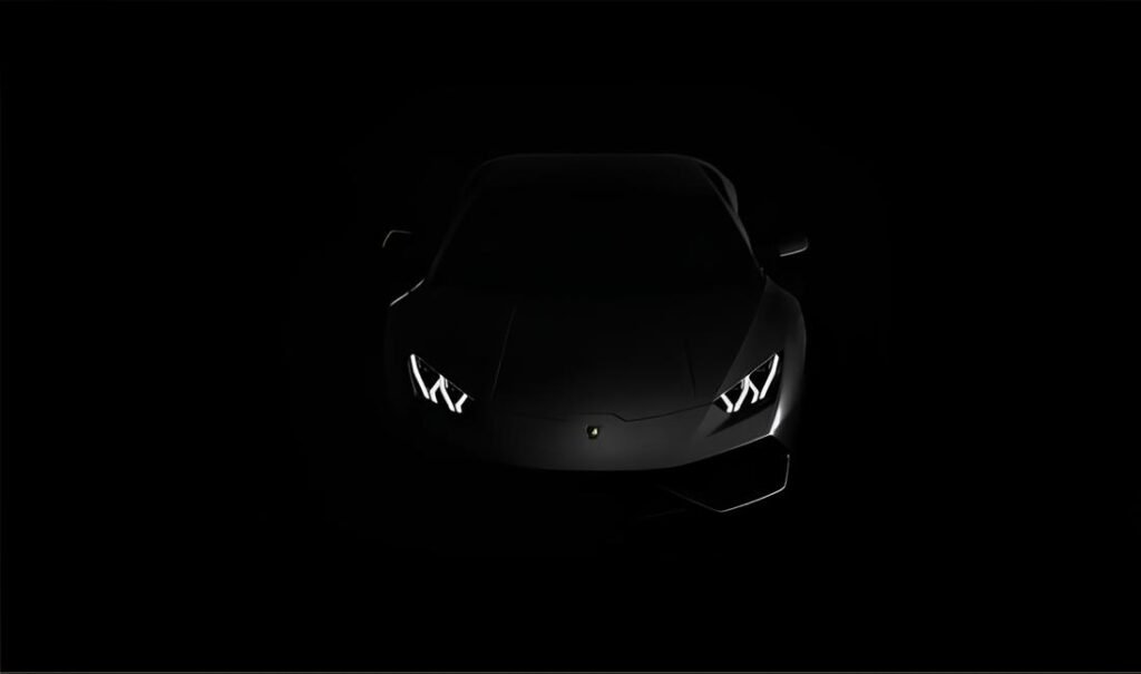 Dark silhouette of Lamborghini with illuminated Y-shaped headlights against black background