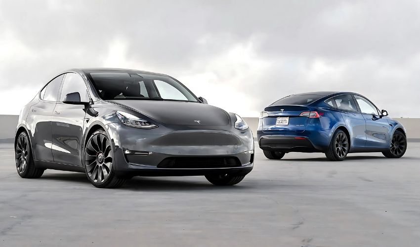 Two Tesla Model Y SUVs parked in a parking lot