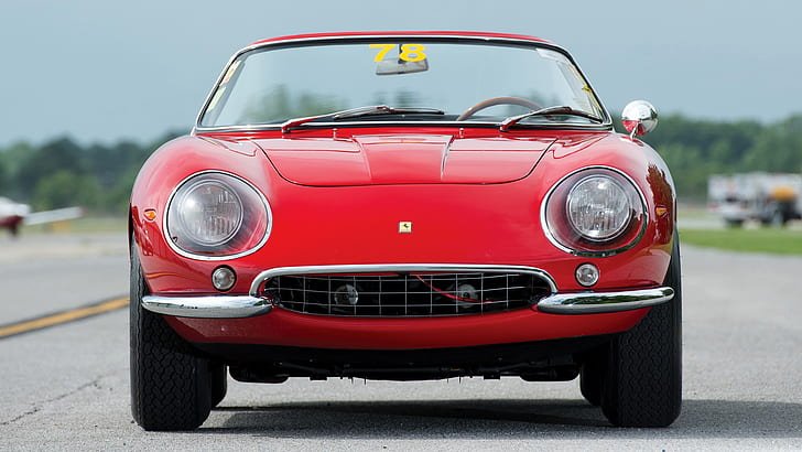 A classic red Ferrari showcasing vintage automotive design and luxury.