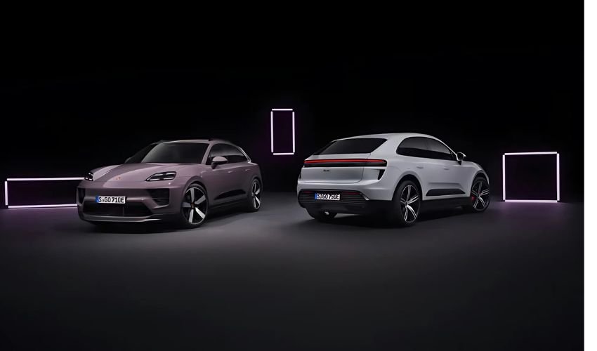 Two Porsche electric crossover vehicles in a dark studio setting with glowing frames.