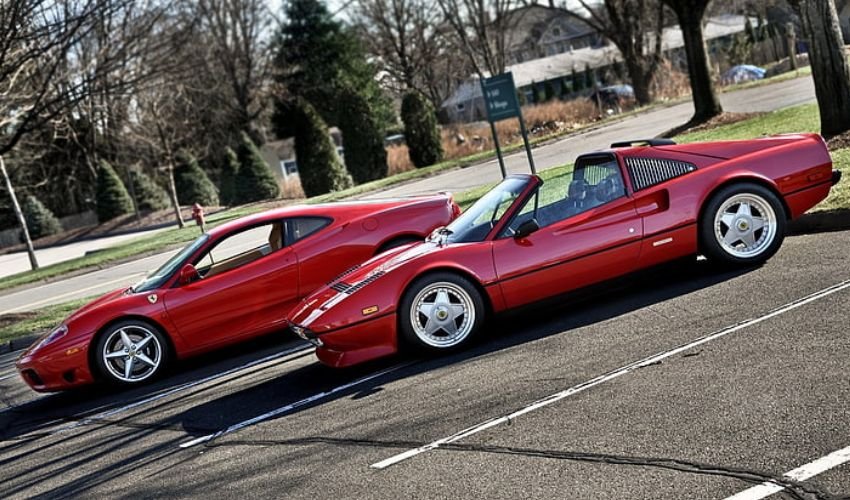 Three cheap Ferrari sports cars parked in a row