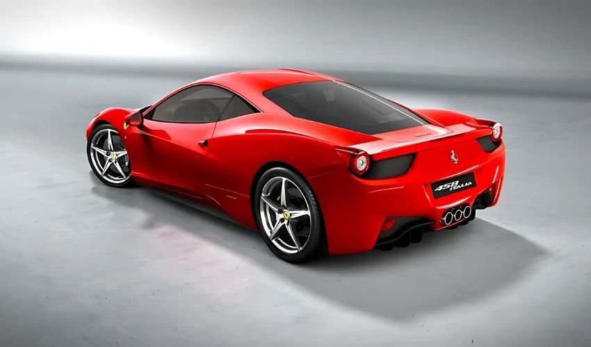 A cheap red Ferrari 458 Italia is showcased in a studio setting